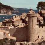 A historic castle with sea views in Tossa de Mar, Spain, showcasing medieval architecture.