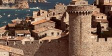 A historic castle with sea views in Tossa de Mar, Spain, showcasing medieval architecture.