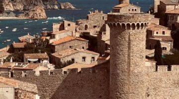 A historic castle with sea views in Tossa de Mar, Spain, showcasing medieval architecture.